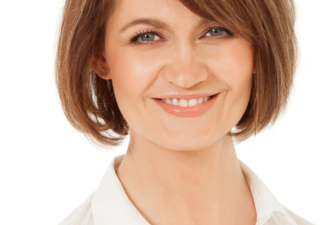 Close-up of smiling adult woman with short hair against of white background. Isolated.